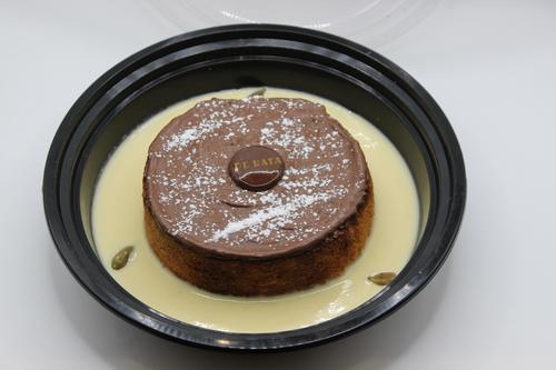 DE CHOCOLATE CUSTARD BRIOCHE - wake up to the heavenly taste of chocolate with cardamom in a dish made with soft creamy brioche, filled with sticky pastry cream ,topped with chocolate sauce and drizzle of powdered sugar ,all surrounded by lashing of aromatic cardamom custard ,for full flavor and enchanting texture .