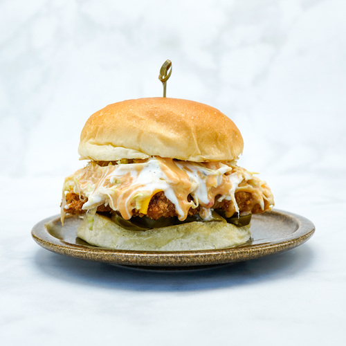 Spicy Chicken Burger - Breaded Fried Chicken, Cheddar Cheese, Iceberg, jalapeno ,Ranch, Homemade Spicy Sauce Served In Freshly Made Potato Bun.