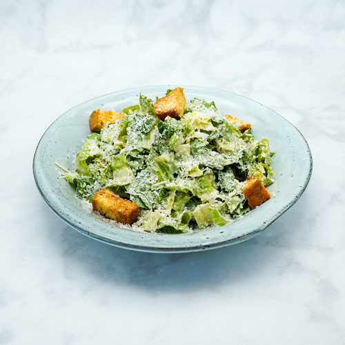 Caesar Salad - Romain Lettuce,Croutons And Caesar Dressing,Topped With Parmasen Cheese.