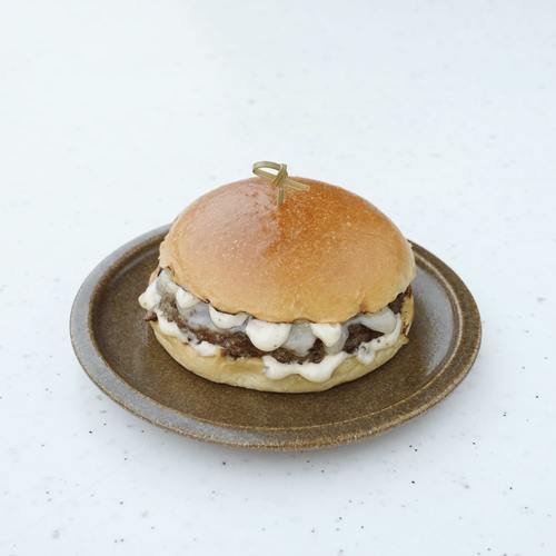 TRUFFLE BURGER - A 130g charcoal-grilled beef patty, topped with creamy provolone
cheese and finished with rich truffle sauce, all nestled in a freshly baked
brioche bun.
