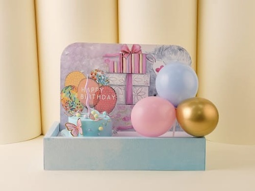 Single cake with blue balloons