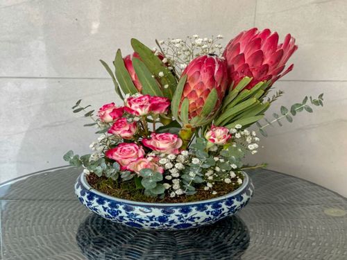 Protea And Baby Rose Assortment - An assortment of Protea, Baby Rose and other flowers