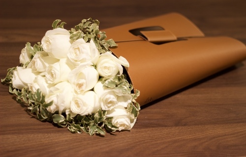 Brown leather flower bag