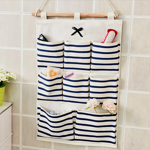 Bathroom hanger organizer - Bathroom Hanging Organizer 8 Pockets . High quality cotton and linen fabric, strong, healthy and eco-friendly 
   Cute hanging organizer, practical and decorative. 
   Perfect for organizing: bedrooms, closets, laundry room, playroom, college dorm room, etc. 
   A good helper for putting keys, cell phone, glasses, cosmetics, hair clips, cards and all the little things you want, keeping your room tidy and organized.