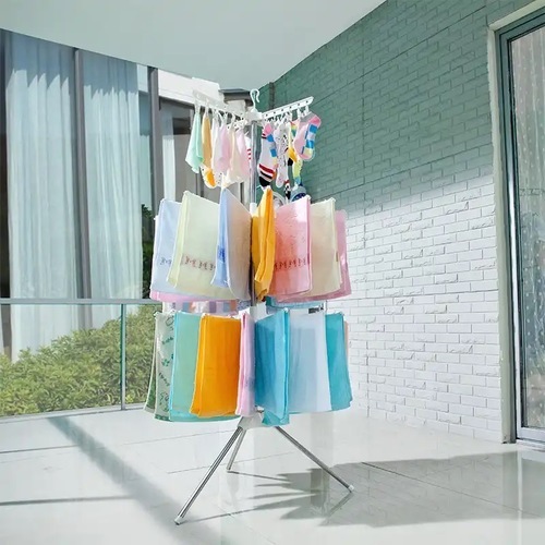 Three-level foldable clothes drying rack - A versatile, space-saving laundry dryer that dries and airs your clothes naturally and gently 
 Rotatable and foldable 
 Contains 24 small tongs, 32 applicators, 360-degree rotation with three layers, 
 White color 
 Material: aluminum and plastic