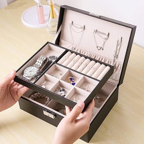 Jewelry storage box with lock - This jewelry storage case has a variety of storage spaces, including 
ring holders and watch holders, so you can store jewelry and watches by 
item. 
   The upper and lower sections can be divided 
into 6 sections for storing small items, and the divider drawer can be 
removed to create a large space.  Mix and match hair accessories or 
stock up on longer items like bracelets for the season to suit your 
preferences. 
   The two-tier compact design can hold all
 your jewelry and accessories (necklaces, rings, bracelets, hoop 
earrings, pendants, hair accessories, watches, sunglasses, etc.). 
  
 The surface is made of protected pu leather, so you don't have to worry
 about it getting dirty.  In addition, its color and texture are elegant