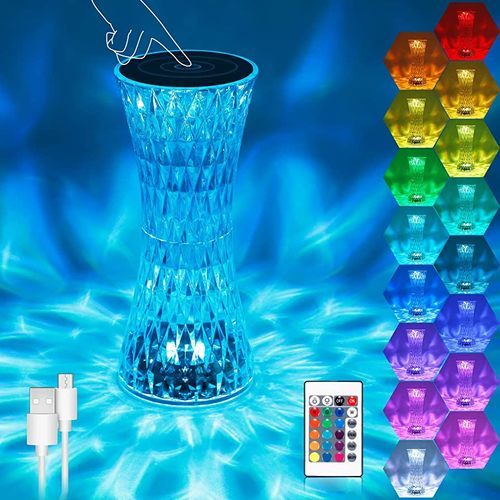 Amazing crystal table lamp - Rose crystal decorative table lamp created by unique 3D cutting technology reflects brilliant and colorful lights with its modern and luxury look.
 Suitable in the room, living room, dining room, creating a romantic and warm atmosphere
  Rechargeable desk lamp
 The RGB desk lamp has a built-in 2000mAh large capacity battery.
 The newly upgraded built-in USB charging interface design allows you to charge safely and worry-free (USB charging cable is included), can be used for 6-8 hours after charging for 3 hours, and can accompany you all night on a single charge.
  16 colors RGB LED diamond light has 3 colors of red, green, blue and 16 dynamic colors (warm light + warm white light + white light + yellow light + blue light + red light, etc.), 4 dynamic modes, 6-level brightness adjustment,  You can choose your favorite color and lighting mode according to your mood to create a romantic atmosphere
 The diamond table lamp is designed with a single touch, and it can instantly change the dimming with a touch of the hand, and long press for three seconds to turn off;  The remote control has 24 keys (with instruction manual), the touch screen and the remote control use an upgraded chip, the response speed is sensitive, the color tone change only takes 0.001 seconds, the connection is stable, and everything is in your hands.
   The small waist-shaped table lamp is made of acrylic material, which is safe and insulated, not easy to damage, and the light transmittance is more than 95%.  The RGB light is reflected on the ground through the diamond crystal, showing a brilliant LED light source.  Stylish appearance and flashing lights are combined to create a wonderful visual feast of light and shadow for you.