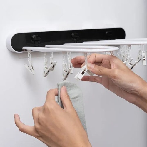 Foldable multi-clips clothes rack - .  This laundry rack is thick, sturdy and durable, and can hang a lot of clothes at one time. 
  The foldable design gives the clothes rack space-saving properties.  When you're not drying clothes, it can lean against the wall without taking up space at all. 
  It can match your home decoration, and it will add a nice decorative touch to your home. 
    You can place this clothes drying rack on your balcony, bathroom, laundry room, or by your bedroom window. 
   .  Good material, useful and durable.