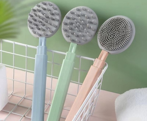 Telescopic shower brush - The extendable shower brush makes it easy to clean hard-to-reach places by hand.. Made of silicone 
  Two different heads, soft and gentle on the skin 
    Soft silicone bristles for comfortable cleaning 
   Soft silicone bristles for a comfortable massage 
   Three-section telescopic handle for extension 
   Length: 24.5 to 46.5 cm