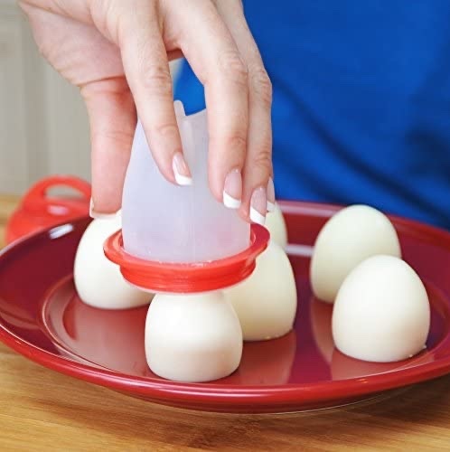 Egg silicone - GREAT DESIGN：6 individual non BPA , non-stick silicone egg cooking cups, Easy to make soft or hard boiled eggs, scrambled eggs, mini omelet’s, egg Benedict’s and more. Prepare a surprise breakfast for your family.
EASY TO USE：Just crack open the eggs, pour into this cooking cup, boil and serve.
DETAIL DESIGN: There are 4 brackets on the bottom for more stable placement of your egg cup; the lid has 6 vents to prevent the bursting of the egg cup during cooking.
PLEASE NOTE: Eggs cups are NOT INTENDED FOR USE IN THE MICROWAVE: Please use caution when handling as contents will be very hot.
TIPS: Dishwasher Safe and easy to clean.

Cooking Tips:
1. We recommend that you spray some oil before you put the egg liquid in the egg cup. When the egg is cooked, it will be easier to pour it out. If you don''t like oil, don''t put it.
2. In order to ensure that the cooked eggs have a perfect shape, properly control the water inside the pot to prevent them from tumbling during cooking.
3.When you take out the cooked egg, if it can''t pop up,stick a spoon in one side to let the air out and THEN they pop right out.
4.You can put in any vegetables you like and create new dishes with the eggs.