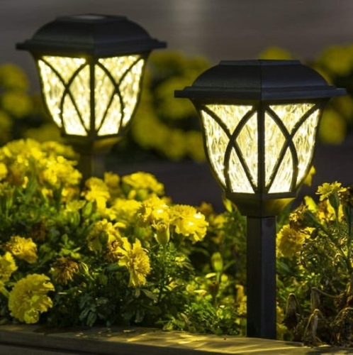 Solar warm white light 6 pcs - The outdoor decorative lighting works by charging with solar energy. It is easy to install. All you have to do is remove the green tape and plant it in the ground.  These solar path lights turn on automatically at night and turn off at dawn   EXCELLENT OUTDOOR DECORATION: Outdoor garden lights can be easy to decorate and add a cheerful warm white glow to your driveway, patio, or flower beds.   Energy saving: no need for electricity;  It absorbs sunlight for charging.  LED lights charged by direct sunlight for 4 to 6 hours can provide 6 to 8 hours of illumination.   Weather resistance: Suitable for outdoor use, do not worry about rain, snow, sleet or sleet.   Determine:  Support IP44 خاصية   Material: plastic   Light color: warm white   Housing color: black   Size: 3.9 x 3.9 x 16.9 inches   Battery: 1.2V / 1pc AA Ni-MH (rechargeable)   Package includes: 6 solar powered LED lights   Solar powered landscape lighting is installed on the ground to illuminate outdoor pathway, driveway, sidewalk, yards, front gate, backyard, country yard, front porch, staircase, or garden.   weather resistance.  Suitable for outdoor use, you don\