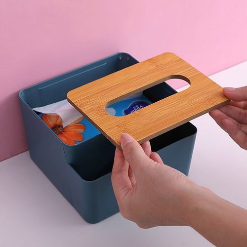 Tissue box with two storage slots