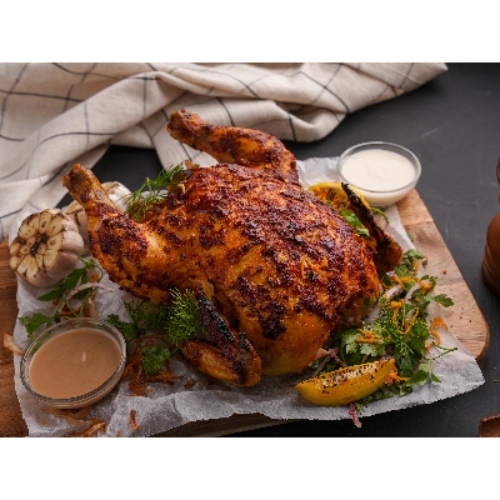 Grilled Chicken and Bread - Marinated chicken served with ,tannour bread and garlic sauce