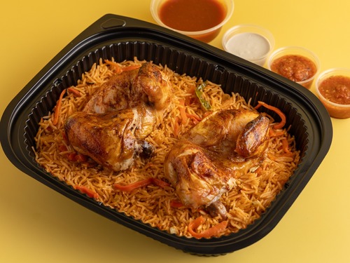 Grilled Chicken With Boukhari Rice - a grilled chicken meal with Bukhari rice, Yemeni daqoos, daqoos, arugula, and onions