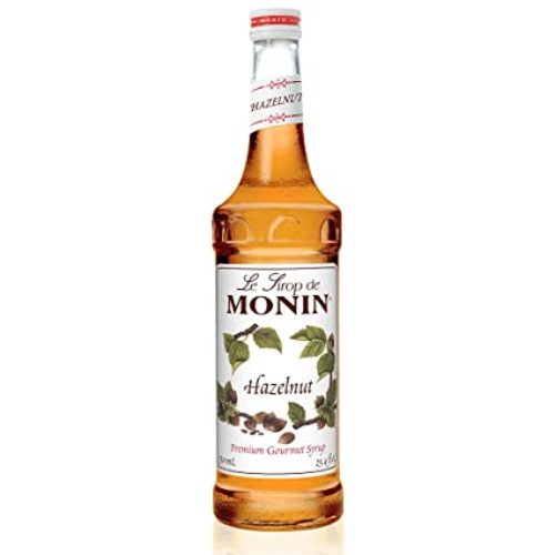 شراب البندق 700 ML - فرنسا - يُعد شراب MONIN Hazelnut ، أحد أفضل النكهات الثلاثة المتخصصة في القهوة ، إلى جانب الفانيليا والكراميل ، المذاق الطازج ورائحة البندق مع لمسة من اللوز والفانيليا. يعد جوز البندق من شجرة البندق ، المعروف أيضًا باسم جوز البندق أو الجوز فيلبرت اعتمادًا على الأنواع ، مكملاً للبندق بالشوكولاتة جيدًا. هذا يجعله شائعًا في صناعة الحلويات بالإضافة إلى كونه مكونًا رئيسيًا في الشوكولاته Nutella. بل هو أيضا نكهة بودنغ شعبية تستخدم في مرنغ وكعجينة في تورتة فيينا. حسّن من القهوة والشوكولاتة ومشروبات الحليب وابتكري مشروبات حلويات راقية مع المذاق الرائع لمونين هازلنوت