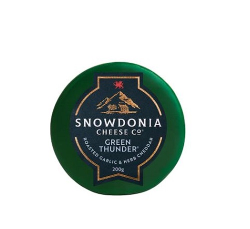 SNOWDANIA CHEDDAR CHEESE With ROASTED GARLIC & HERBS 200G-UK - Fresh, smooth, creamy. Sensationally savoury. Gloriously green. This versatile, characterful Cheddar boldly mingles roasted garlic with aromatic garden herbs. Enrobed in emerald-coloured wax, Green Thunder pays homage to the rolling valleys of Snowdonia.