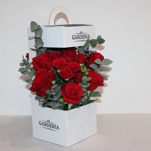 Hand box 1 - gardenia white box 2 sides flowers roses end baby roses  with green