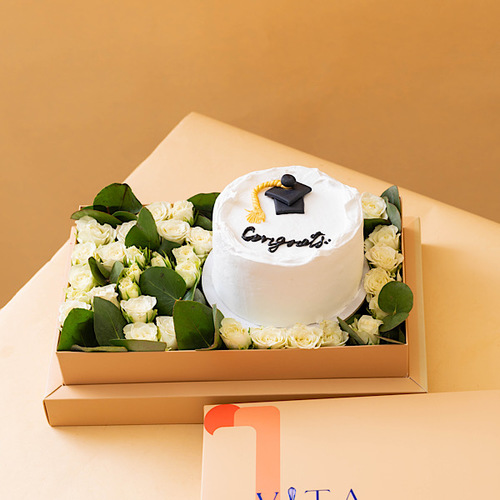 Capro - Box contains graduation cake with white baby roses and green leaves