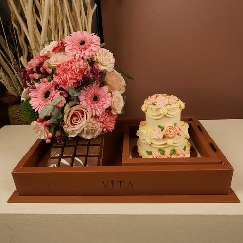 deema - A cake that contains 12 pieces of chocolate and a two layered cake.