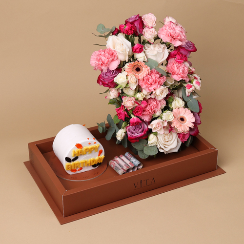 the crown - box contains mixed flowers with cake and amount of money as per requested