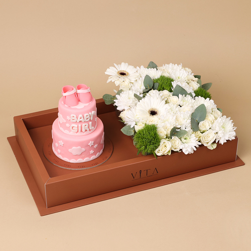 Savor - This box contains a chocolate cake and&nbsp; with an arrangement of roses, gerberas, and carnations.