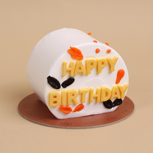 Inri - A box that contains a white cake with chocolate flavor.