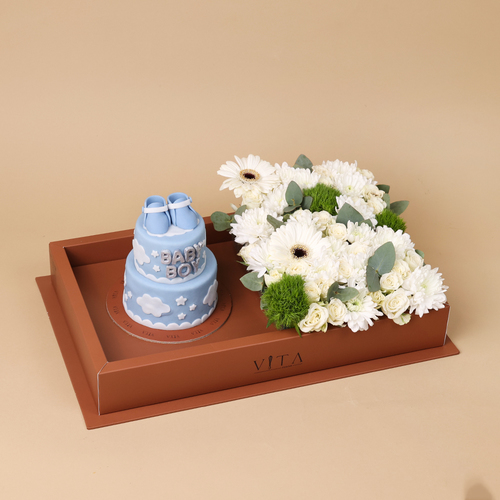 The One - This box contains a chocolate cake and&nbsp; with an arrangement of roses, gerberas, and carnations.