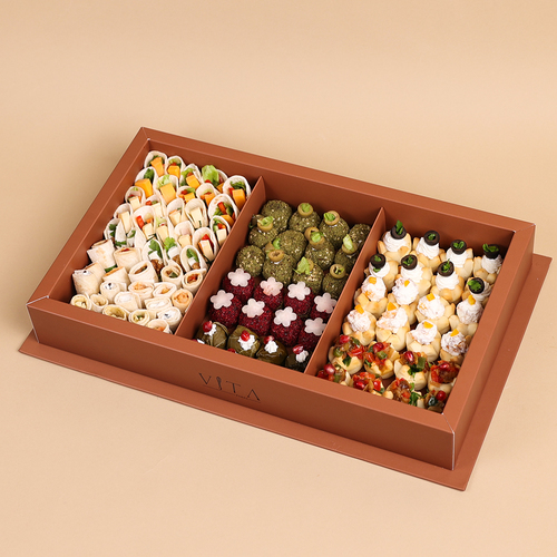 The Toro - This box contains mini pastries with labneh, feta cheese, and eggplant, as well as sumac, zaatar, and pomegranate grape leaves. It also includes mini wraps with fillings of turkey, feta cheese, cheddar cheese, potato, eggplant, feta with olives, and halloumi.