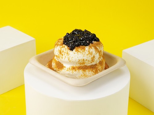 Japanese Pancake - Blueberry - A souffle Japanese pancake sauced with cream cheese sauce flavored with blueberry garnished with our very owned biscuit.