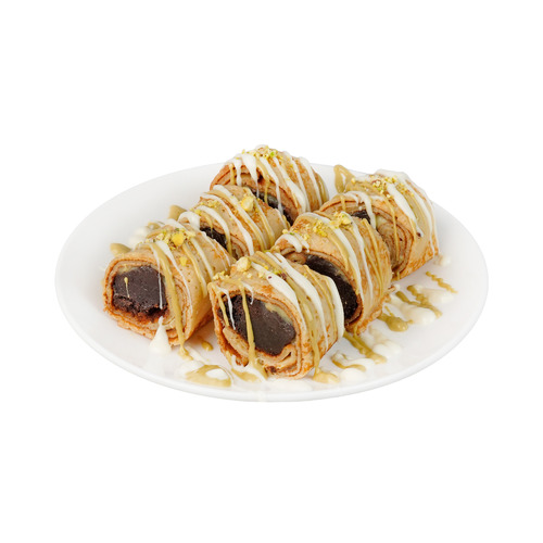 Brownie Sushi Crepe - French pancake made with a thin batter filled with custard spread rolled with brownie bites and sliced into sushi type garnished with white chocolate with on the side dip.