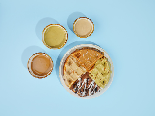 Fluffy Waffle - A waffle serves with 4 flavor of sauces or any of your choice of Belgian, pistachio, lotus, kinder sauce.