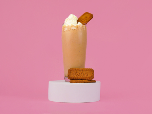 Lotus Milkshake - A blended vanilla ice cream with lotus biscuit and lotus sauce topped with whipping cream.