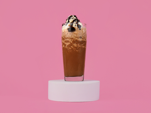 Mocha Frappuccino - Dark chocolate syrup meets coffee, milk, and ice for a rendezvous in the blender with whipping cream.يجتمع شراب الشوكولاتة الداكنة مع القهوة والحليب والثلج في الخلاط