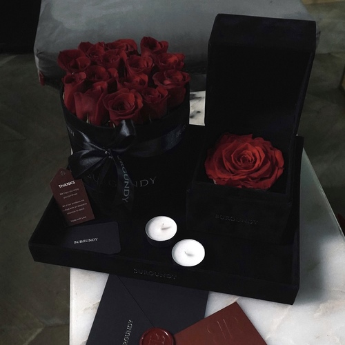 Drama - Drama Design contains 10-16 red roses (depends on the size), Burgundy's Infinity Rose, and 2 small candles.