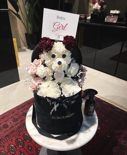 Baby Girl Teddy Bear - A floral arrangement in the shape of a Teddy Bear with Burgundy Card.