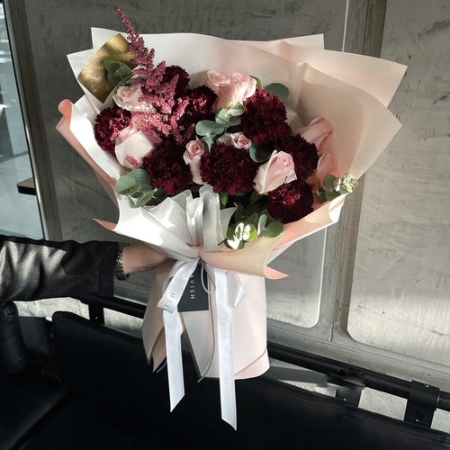 Classic - Maroons Bouquet contains maroon carnations, astilbe, pink roses, and eucalyptus.