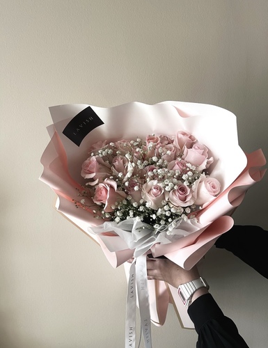 Lavish Flowers - Snow - Pink roses and jepsophilia with Lavish pink wrapping.