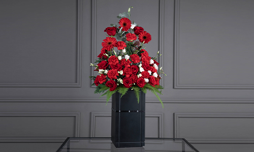 Winter Fresh - A luxurious stand of big roses, carnations, lisanthus and gerbera with mix of leaves.
Height: 95 cm, Width: 50 cm