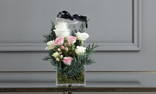 Patroclus Bouquet - A basket contains big roses, baby roses, confern leaves and hyprecom.
Height: 23 cm, Width: 10 cm