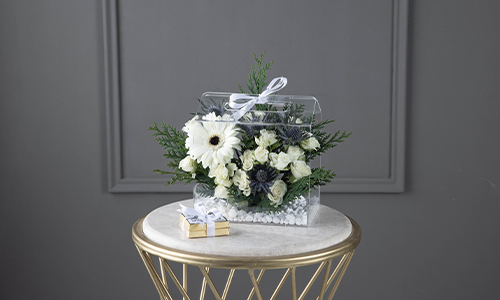 Marimar I - The bouquet contains gerbera, baby roses, erengium and confern leaves with Belgian chocolates.
Height: 23 cm, Width: 20 cm