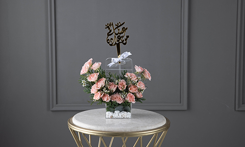 Jular - The bouquet contains baby roses, wax flowers and confern leaves.
Height: 22 cm, width: 10 cm