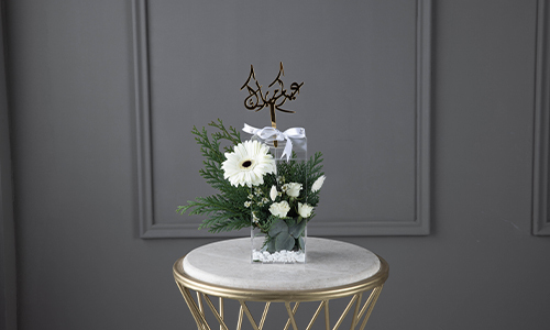 Jenny - The bouquet contains gerbera, baby roses, confern leaves and wax flowers.
Height: 22 cm, Width: 10 cm