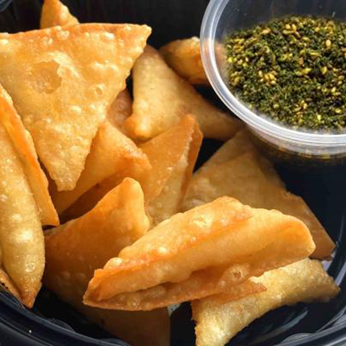 Cheddar And Zaatar Samosa - 12 pieces of samosa stuffed with cheddar cheese, zaatar and olive oil.