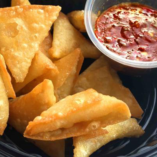 Vegetables And Hot Sauce Samosa - 12 pieces of samosa stuffed with cheddar vegetables and hot sauce.