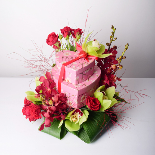 Habib Al Umor 4 - 2
  layer box of chocolates, cookies and fresh roses, cymbidium, baby orchid
  flowers.