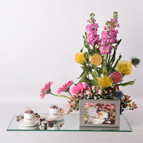 For You Mother 50 - Cake with pins gerbera flowers and coffee cup sets on a mirror tray.