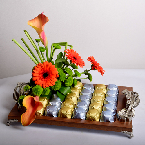 bon appetit 1 - wood
  tray decorated with fresh gerbera and calla flowers with chocolates. 700 grm