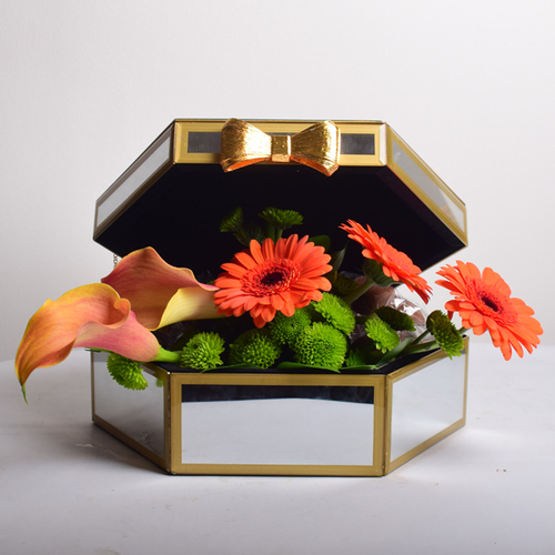 bon appetit 4 - mirror
  box decorated with fresh gerbera and calla flowers with chocolates. 500 grm