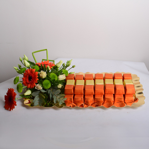 bon appetit 13 - gold
  tray decorated with fresh gerbera flowers and chocolates.