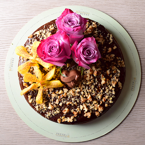 Al Kharif 3 - dates
  cake decorated with fresh roses flowers and chocolates.